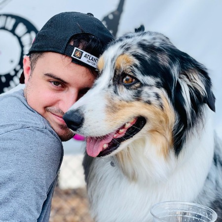 Connor Hutcherson and his pet dog, Loki.